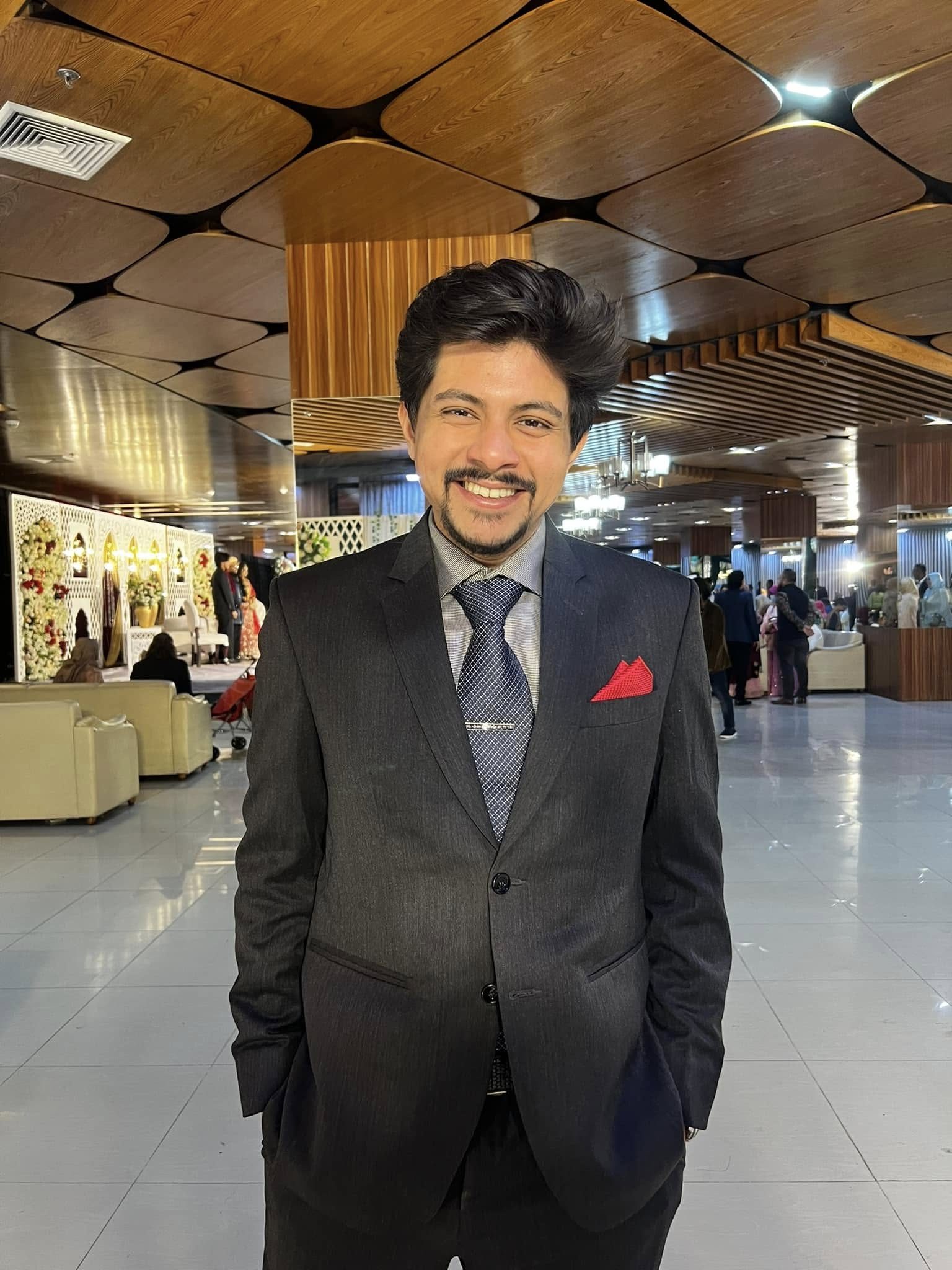 Muntaseer at a formal event